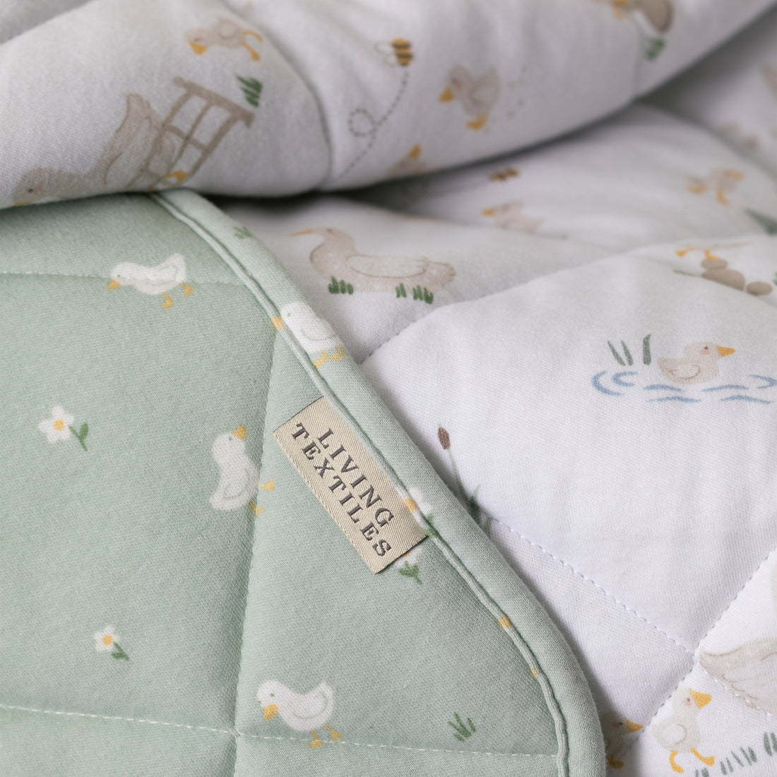 Goosey Goosey - Reversible Organic Jersey Quilted Cot Comforter